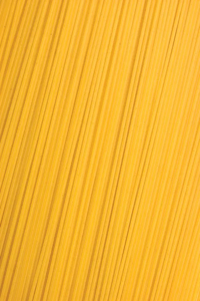 Tradiční špagety těstoviny closeup pozadí — Stock fotografie