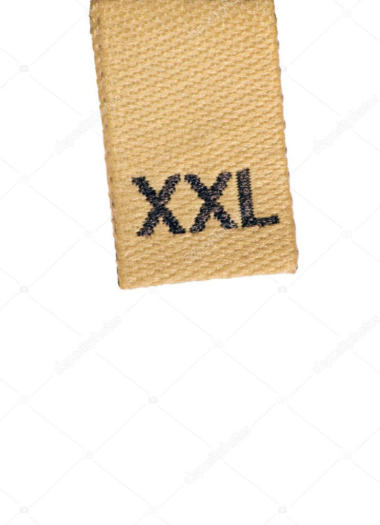 Macro of XXL size clothing label on white, isolated