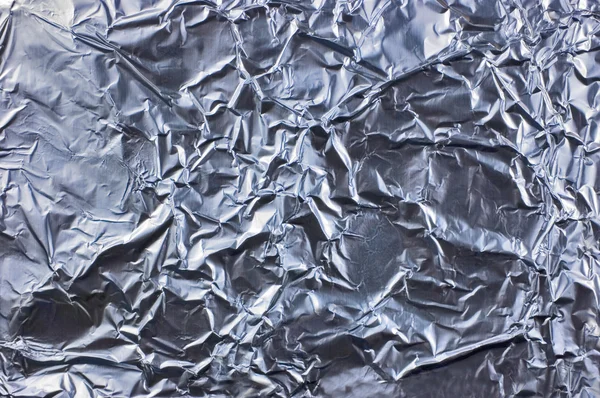Abstrato crumpled prata alumínio folha closeup fundo textura — Fotografia de Stock