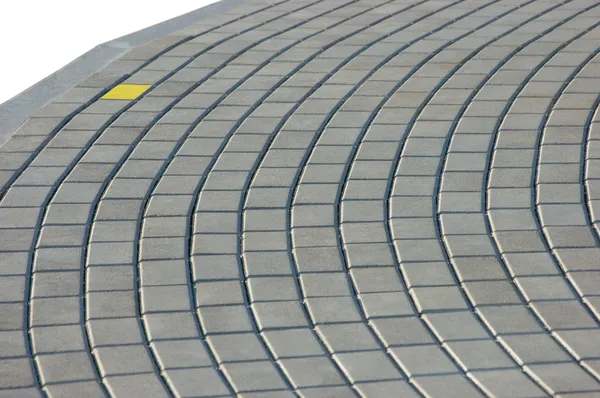 Cobblestone textura del pavimento con ladrillo amarillo —  Fotos de Stock