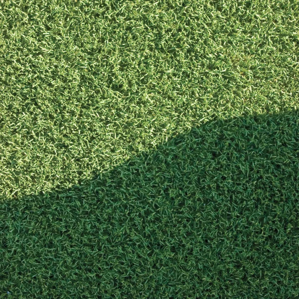 Grama artificial grama falso gramado sintético campo macro closeup — Fotografia de Stock