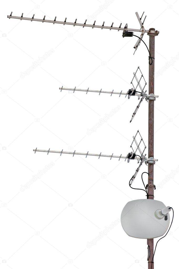 TV and communication aerials on roof of residential house, isolated