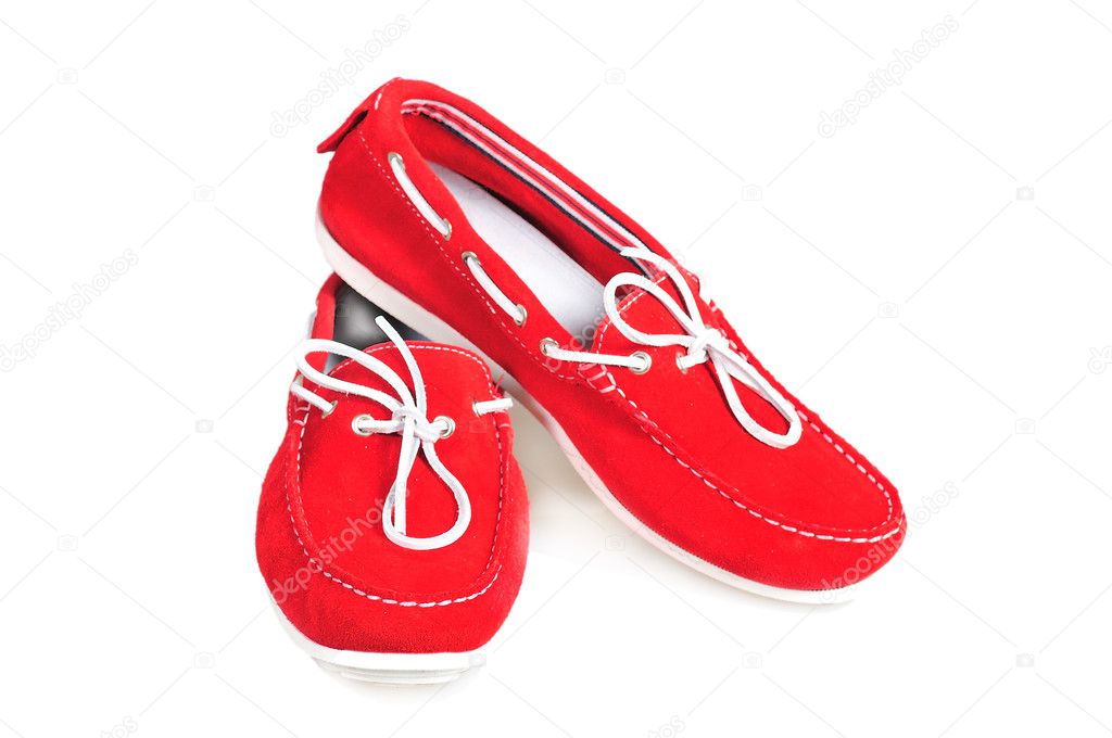 Pair of red moccasins isolated over white