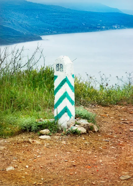 Stony post on summer mountain — Stock Photo, Image