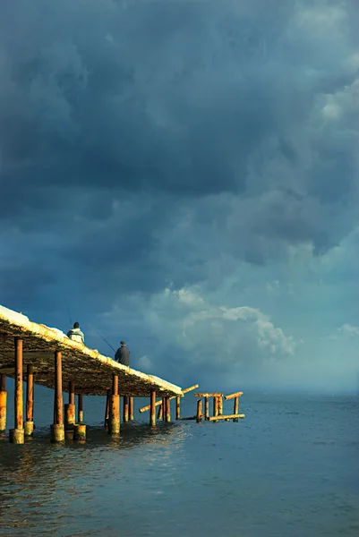 Old pier at beach — Stock Photo, Image
