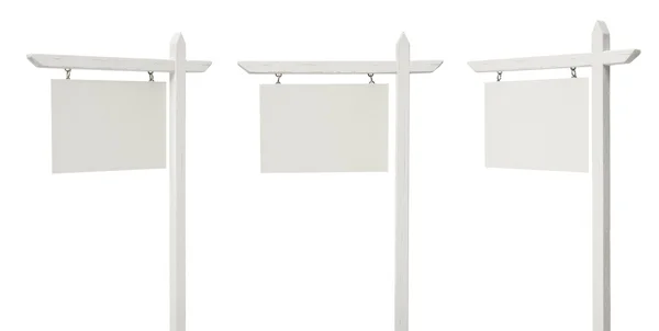 Ensemble de 3 différents panneaux immobiliers vierges inclinés sur blanc — Photo
