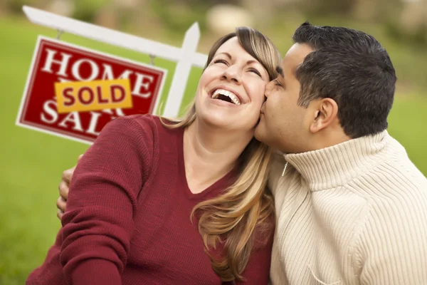 Mixed Race Couple in Front of Sold Real Estate Sign — Stock Photo, Image