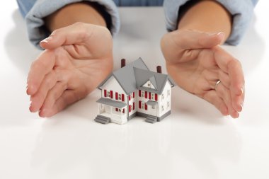 Womans Hands Around Model House clipart