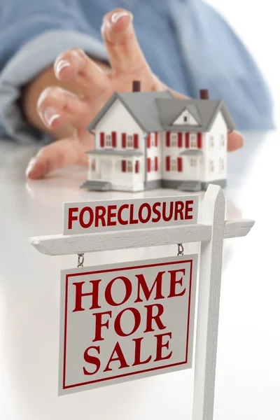 Foreclosure Sign in Front of Woman Reaching for House — Stock Photo, Image