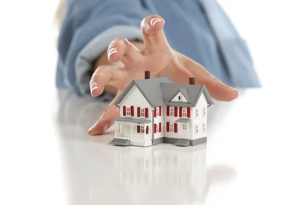 Womans Hand Reaching for Model House on White — Stock Photo, Image