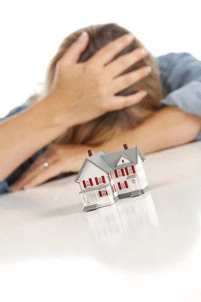 Woman with Head in Hand Behind Model Home — Stock Photo, Image
