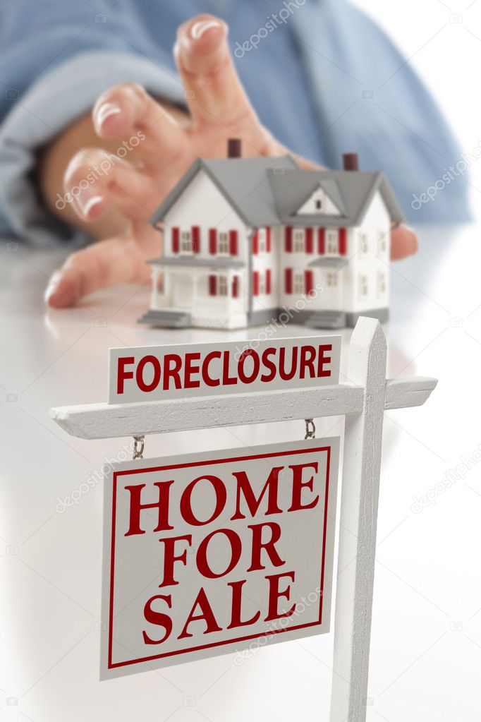 Foreclosure Sign in Front of Woman Reaching for House