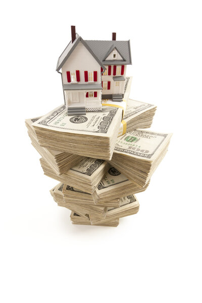 Small House on Stacks of Hundred Dollar Bills