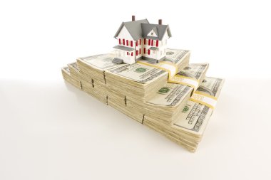 Small House on Stacks of Hundred Dollar Bills clipart