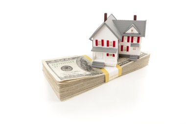 Small House on Stack of Hundred Dollar Bills clipart