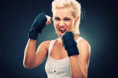 Attractive blonde fighter girl clipart