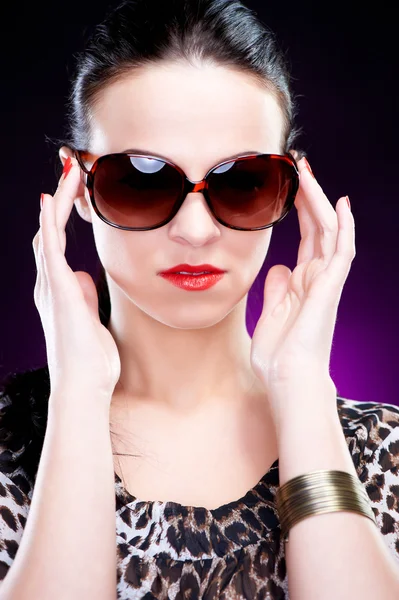 Beautiful elegant young woman with sunglasses — Stock Photo, Image