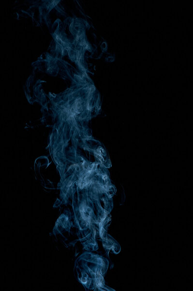 Abstract blueish smoke on black, studio shot