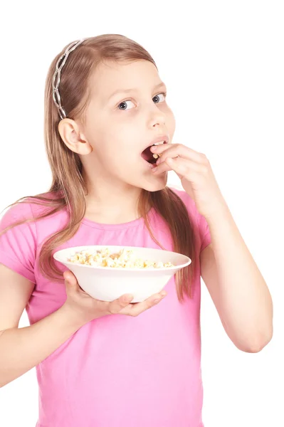 Portrait of a little girl with popcorn on white — Stock Photo, Image