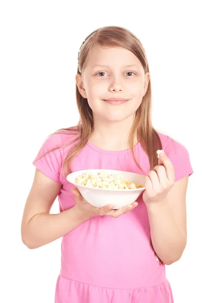 Portrait of a little girl with popcorn on white — Stock Photo, Image