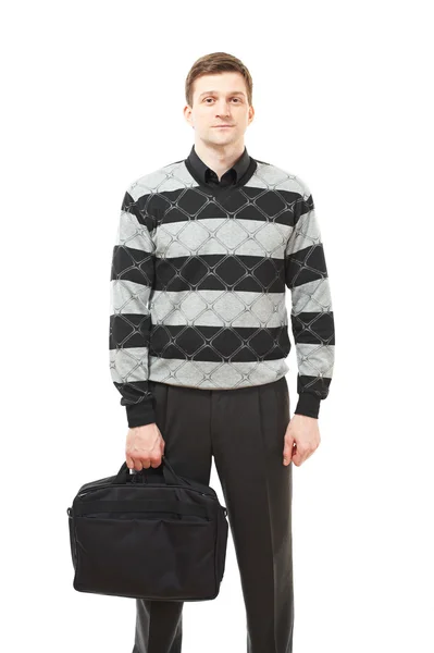 Atraktivní mladý muž v svetru s případem v rukou — Stock fotografie