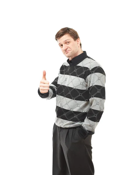 Aantrekkelijke jonge man in de trui duim opdagen — Stockfoto
