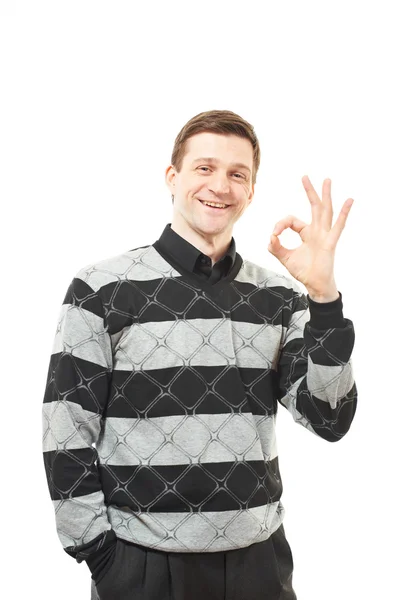 Ελκυστικό νεαρό άνδρα στο πουλόβερ εμφανίζονται αντίχειρα — Φωτογραφία Αρχείου