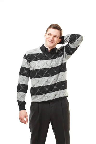 Привлекательный молодой человек в свитере на белом — стоковое фото