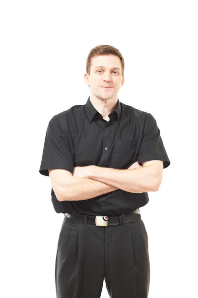 Atraktivní mladý muž v černé košili na bílém pozadí — Stock fotografie