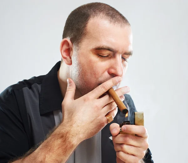 Portrait of serious smoking tough guy with cigar — Stock Photo, Image