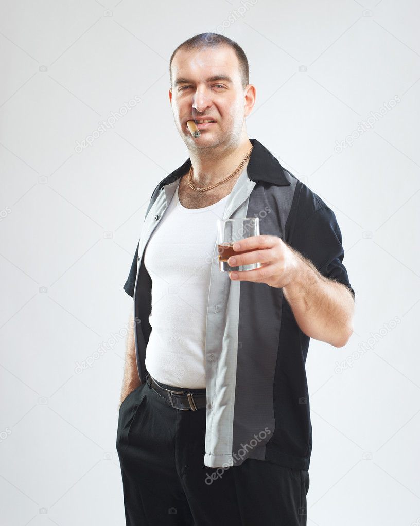 Funny gangster with cigar and glass of alcohol