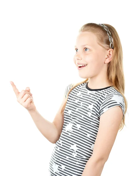 Удивлённая маленькая девочка, указывающая пальцем — стоковое фото