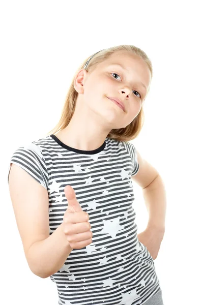 Удивлённая маленькая девочка, показывающая большие пальцы вверх — стоковое фото