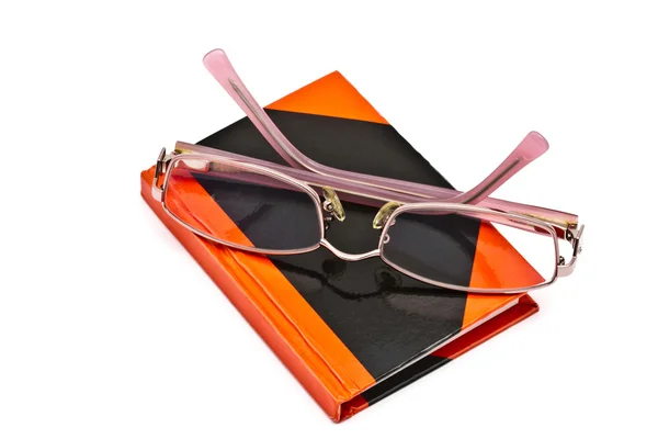 Caderno e óculos de leitura — Fotografia de Stock