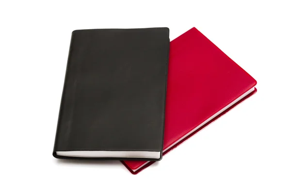 Красные и черные блокноты — стоковое фото