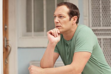 Man pondering on the ledge