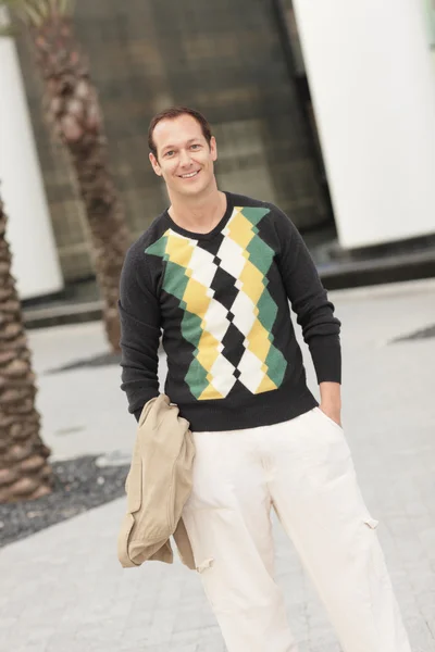 Man in an argyle sweater — Stock Photo, Image
