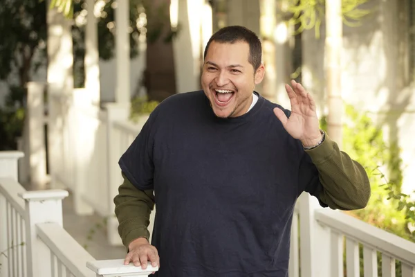 Man smiling and waving — Stock Photo, Image