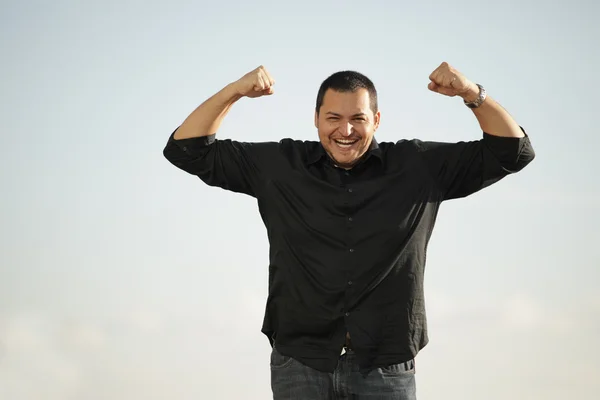 Man flexing his arms — Stock Photo, Image