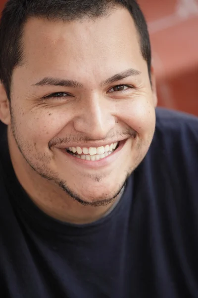 Headshot of a smiling Latino — Stock Photo, Image