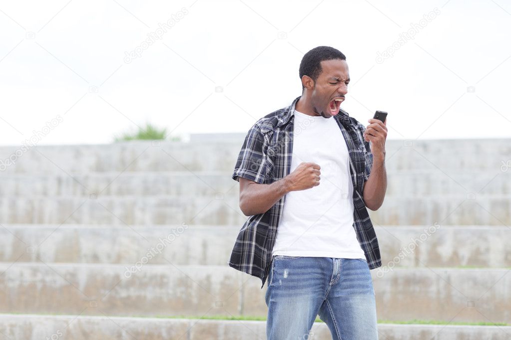 Man screaming at his mobile phone