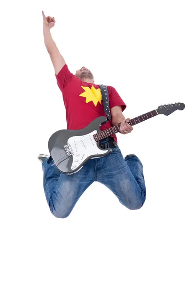 Passionate guitarist making a jump — Stock Photo, Image