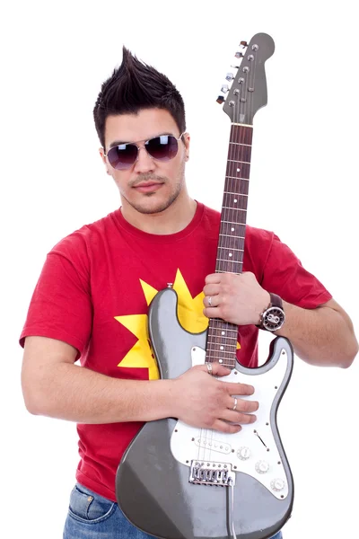 Guitarist embracing his electric guitar — Stock Photo, Image