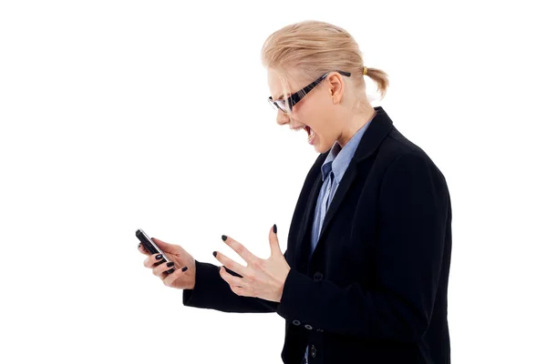Злий бізнес-леді з мобільним телефоном — стокове фото