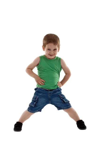 Young boy standing with hands on hips — Stock Photo, Image