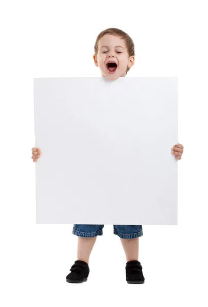Förvånad liten pojke håller en skylt — Stockfoto