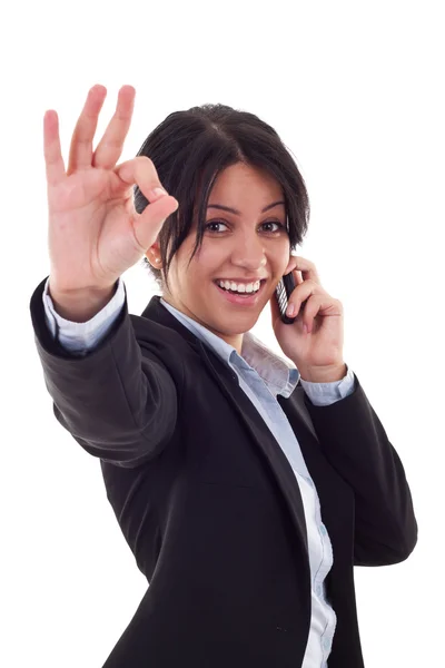 Γυναίκα των επιχειρήσεων με τηλέφωνο και εντάξει χειρονομία — Φωτογραφία Αρχείου