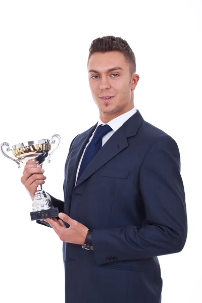 Vítěz s obleku drží pohár — Stock fotografie