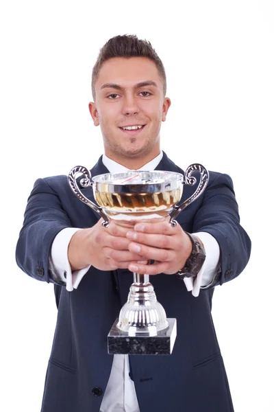 Šťastný obchodní muž podal pohár — Stock fotografie