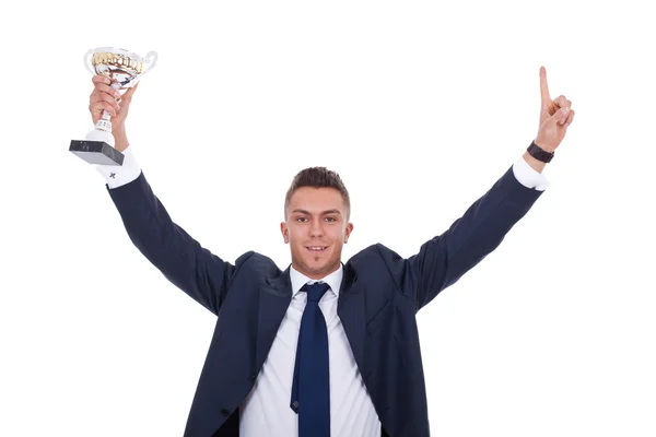 Business man holding a trophy — Stock Photo, Image